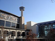 The Henry B. Gonzalez Convention Center and Lila Cockrell Theater along the San Antonio River Walk. The Tower of the Americas is visible in the background. SACC Nima.jpg