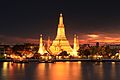 Image 27Wat Arun, the most prominent temple of the Thonburi period, derives its name from the Hindu god Aruṇa. Its main prang was constructed later in the Rattanakosin period. (from History of Thailand)