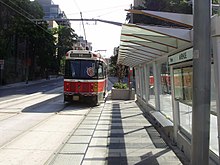 A CLRV serving the 512 St. Clair streetcar route departs eastbound from Avenue Road toward St. Clair station along its private right-of-way along St. Clair Avenue in 2008. 512 ROW at Avenue.jpg