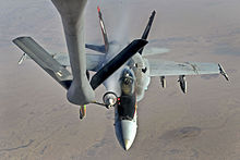 A U.S. Navy F-18E Super Hornet receives fuel from a KC-135 Stratotanker over Iraq before conducting an airstrike, 4 October 2014. The aircraft are supporting operations against ISIL A U.S. Navy F-18E Super Hornet receives fuel from a KC-135 Stratotanker over Iraq before conducting an airstrike, Oct. 4, 2014. The aircraft are supporting operations against the Islamic State of Iraq and the Levant, or ISIL.jpg