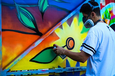 Spray-painting flowers in an elastomeric respirator