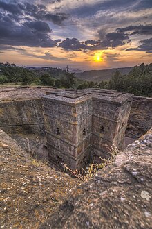 The Church of Saint George, Lalibela a pilgrimage site for Ethiopian Orthodox Tewahedo Church; the site is part of the UNESCO World Heritage Site "Rock-Hewn Churches, Lalibela". Ethiopia - sunset at Church of Saint George, Lalibela 02.jpg