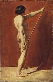 Nude man holding a long pole