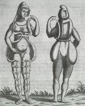 A front and back illustration of a Renaissance-era hermaphrodite showing a person with female facial features, breasts, and what appears to be a small penis or large clitoris. She wears a small hood and open robe tied multiple times around the legs. Where it opens in the front, the apparent rear appearance shows it to be perhaps a shell of some kind, as one with her body. Two squares are missing from her the back of her head and torso. She has no buttocks.