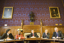 Several men seated at a large table