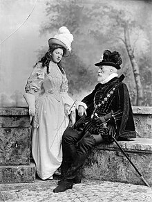 Old man and his daughter in 18th-century dress