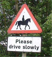 A pictographic traffic sign (top) warning motorists of horses and riders Road-sign-horse.jpg