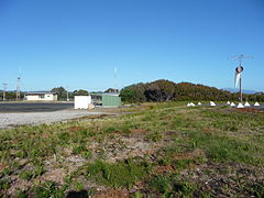 Airport windsock and buildings