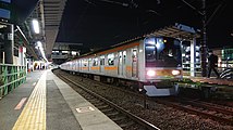 代走で青梅線に入線した209系1000番台（小作駅）