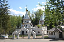 White Orthodox church in a wooded setting