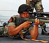 A member of the F-FDTL Naval Component training with a United States Marine Corps M-14 sniper rifle