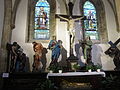 Altar in the northern nave, painted windows