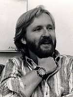James Cameron in 1986. He has a full beard and wearing a Rolex watch on his wrist