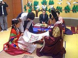 A modern enactment of the traditional pyebaek ceremony, which is usually held after the wedding ceremony Korean wedding-Honrye-Pyebaek-02.jpg