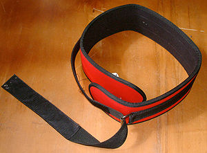 A lifting belt is sometimes worn to help suppo...