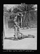 Director of the Zoo, Major Barker, playing with a lioness, 1936.