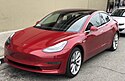Tesla Model 3 parked, front driver side.jpg