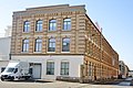 Mehrere Fabrikgebäude und ein Werkstattgebäude einer ehemaligen Textilfabrik