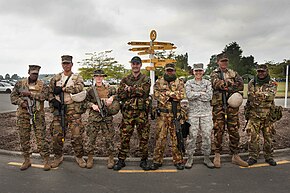 Military service members of different nationalities wearing a variety of combat uniforms in 2013. 20131114 WB N1026341 0004.jpg - Flickr - NZ Defence Force.jpg