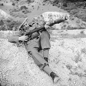 A member of the Home Guard demonstrates a rifle equipped to fire an anti-tank grenade, Dorking, 3 August 1942. H22061.jpg