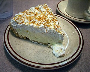 Photo of a slice of coconut cream pie. Taken a...