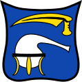 Gemeinde Burgkirchen a.d.Alz In Blau eine silberne Retorte auf goldenem Dreibein, darüber waagrecht schwebend ein goldenes Sensenblatt.