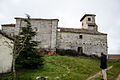 Fachada sur, espadaña y habitáculo para el toque de campanas.