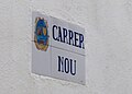 Placa de carrer on es pot veure l'escut.