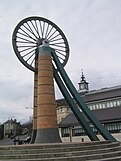 The old winding wheel on a headframe, now in the centre of Radstock, in front of the Radstock Museum