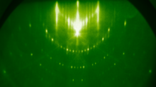 RHEED pattern of a reconstructed silicon (111) 7x7 surface. The stronger spots are from the bulk and basic surface cell, the weaker ones are from the reconstruction