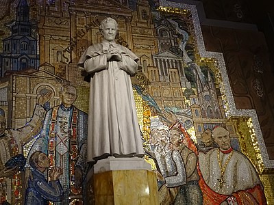 Statue and mosaic of Saint Jean Bosco (right transept)