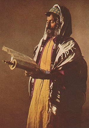 A Yemenite Jew at morning prayers, wearing a k...