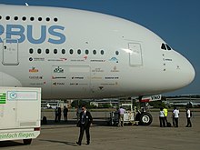 Co-branding with Airbus branding along with customer airlines' logos on an A380 fuselage during the 2011 MAKS air show Airbus A-380 Cockpit.jpg