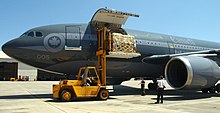 United States Navy personnel unload Canadian relief supplies from a Royal Canadian Air Force transport aircraft in Pensacola, Florida. Canadian relief transport.jpg