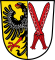 Gemeinde Sachsen b.Ansbach Gespalten; vorne in Gold ein rot bewehrter schwarzer Adler am Spalt, hinten in Silber zwei schräg gekreuzte rote Kurzschwerter.