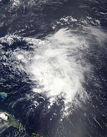 Satellite image of a disorganized mass of clouds over open waters