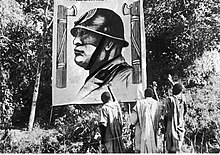 Ethiopians greeting a depiction of Mussolini at Mekelle, 1935. Depiction of Mussolini in Mekelle.jpg