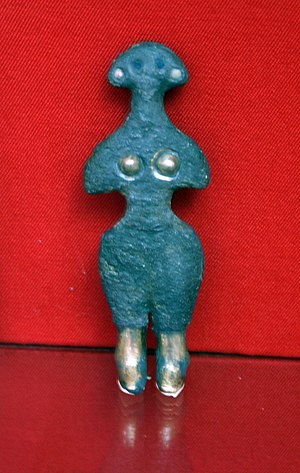 English: A silver female statuette, possibly r...