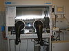 An ordinary glovebox, showing the two gloves for manipulation, with airlock on the right.