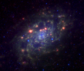 NGC 2403 in Mid-infrared view, combining the 3.6, 8.0 and 24 µm bands of the Spitzer Space Telescope
