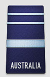 A black shoulder board with the word "AUSTRALIA" across the bottom. Above the word is a thick, blue horizontal stripe, with two thinner blue horizontal stripes above that.