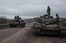 T-80BV and T-64 tanks from Ukraine's 93rd Mechanized Brigade on the Bakhmut-Soledar front, December 2022 UA 93rd bgd T-80BV improvised armor.jpg