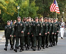 The Ranger Honor Platoon marching in their tan berets and former service uniform Wayne Downing funeral honor guard.jpg