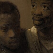 Potret dekat sebuah lukisan wajah dua orang kulit hitam