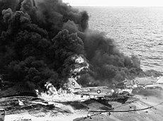 January 14: Explosion kills 27 on USS Enterprise Aircraft burning on USS Enterprise (CVN-65).jpg