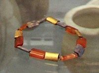 Gold, carnelian and lapis-lazuli beads, tomb PG 1236