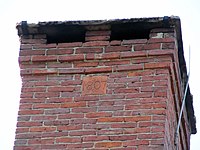 Brick reading "1807" in the chimney