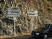 Road signs in Corsica with the French (or Italian) placenames blotted out Corsican nationalism.jpg