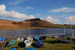 Picture of a reservoir with sailing boats on land bordering the water