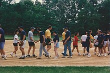 Handshakes at the conclusion of a championship game in a co-ed recreational league, as seen in New Jersey in 1997. Exxon Intramural Softball League - SU&P vs Defectors - Field 2 - handshakes after Championship Game - 12 Aug 1997.jpg